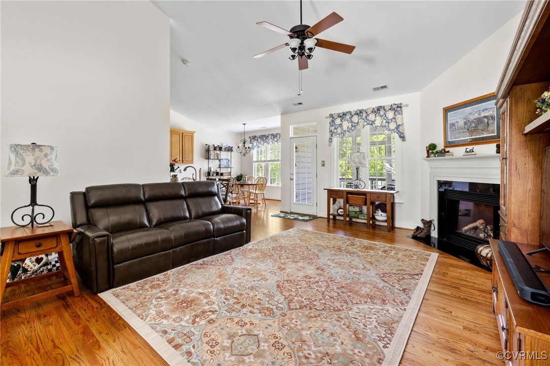 1629 Olmstead Drive Powhatan, VA 23139 - Photo 12 of 50 a living room with furniture rug and a fireplace