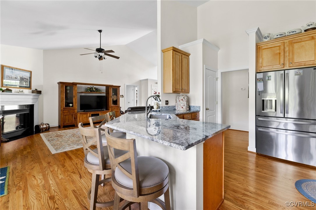 1629 Olmstead Drive Powhatan, VA 23139 - Photo 15 of 50 a kitchen with sink refrigerator dining table and chairs