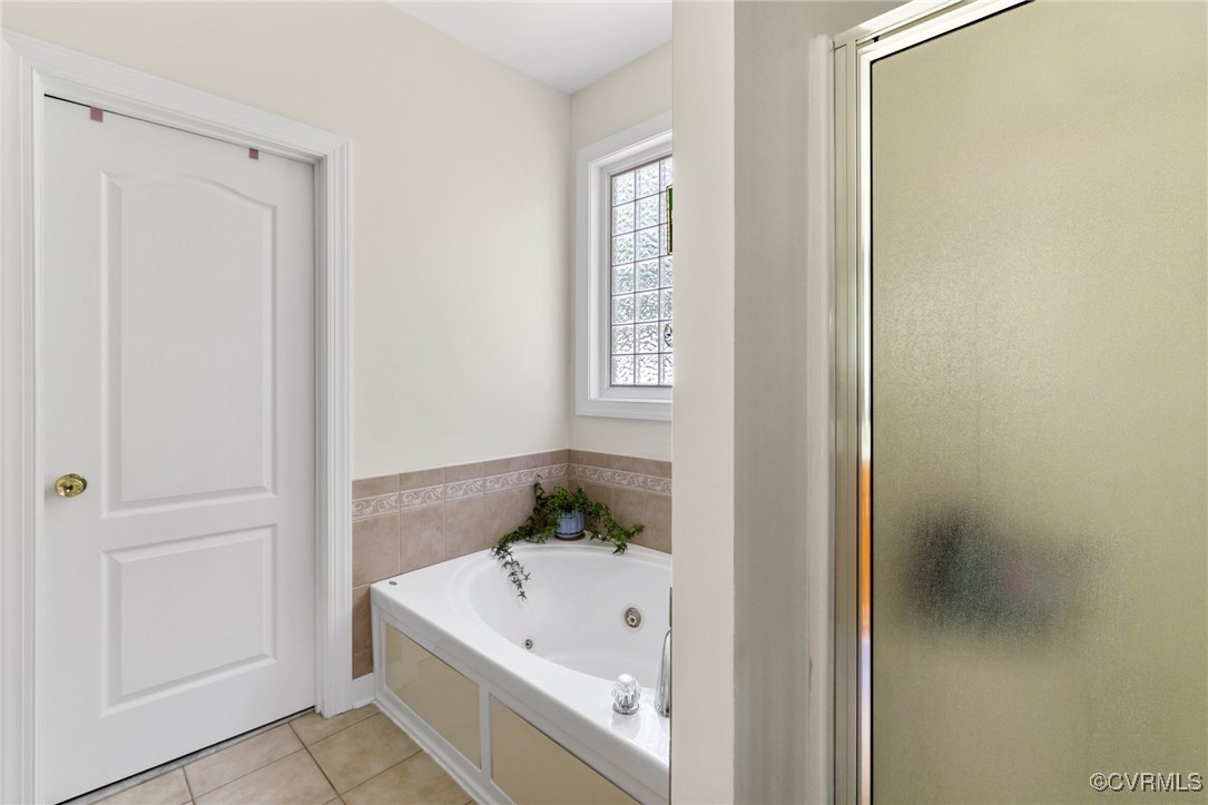 1629 Olmstead Drive Powhatan, VA 23139 - Photo 20 of 50 a bathroom with a tub and shower