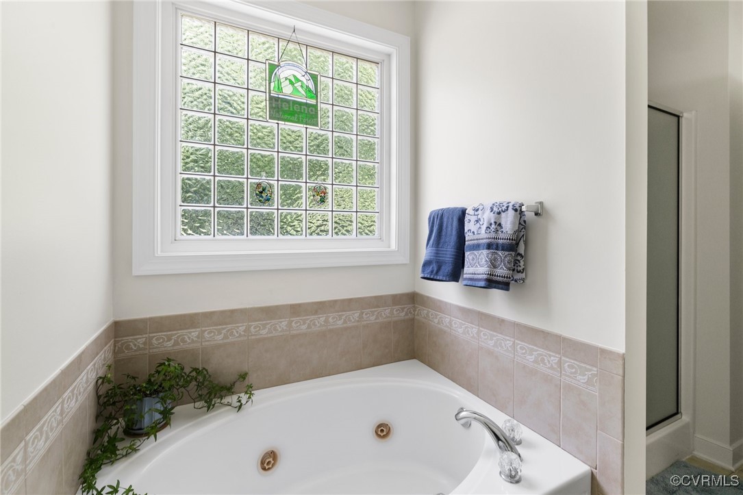 1629 Olmstead Drive Powhatan, VA 23139 - Photo 21 of 50 a bathroom with a tub and a window