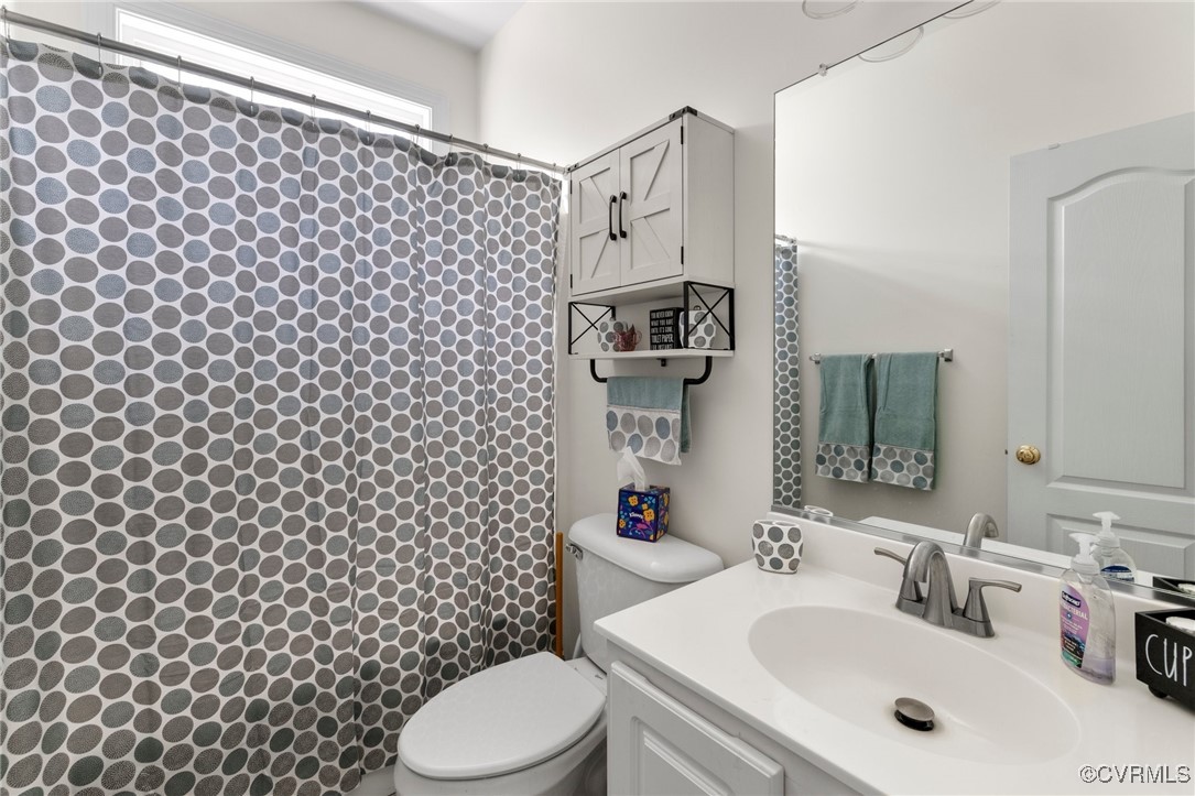 1629 Olmstead Drive Powhatan, VA 23139 - Photo 23 of 50 a bathroom with a sink and a mirror