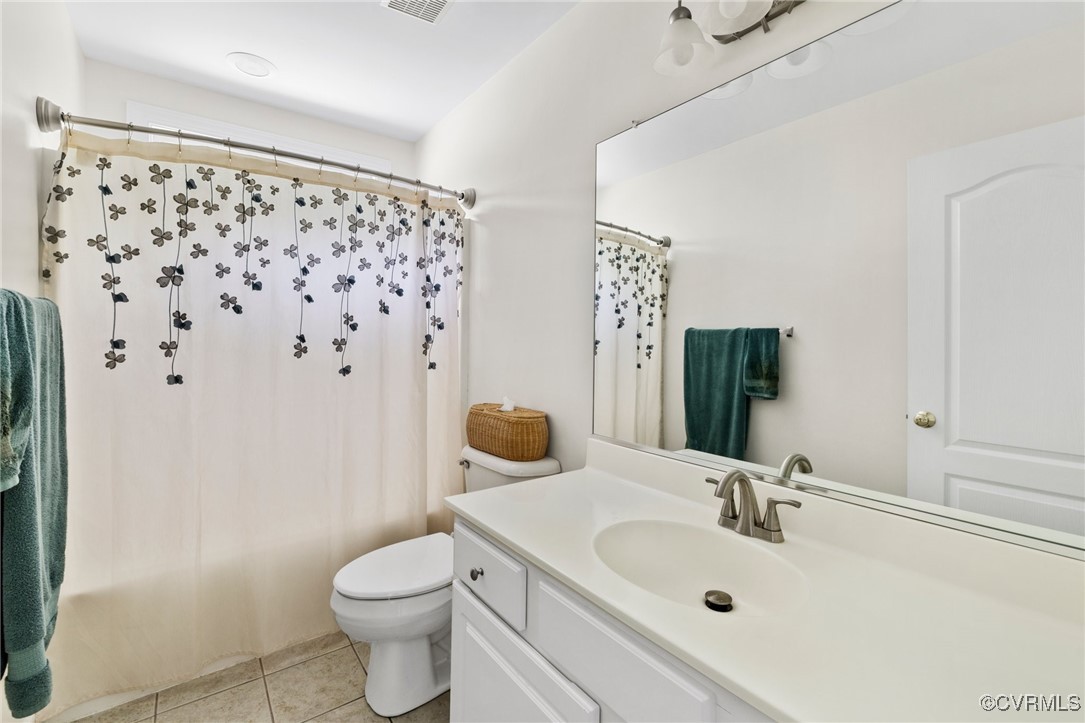 1629 Olmstead Drive Powhatan, VA 23139 - Photo 26 of 50 a bathroom with a sink toilet and shower