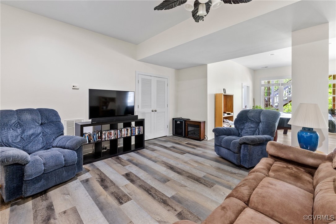 1629 Olmstead Drive Powhatan, VA 23139 - Photo 28 of 50 a living room with furniture and a flat screen tv