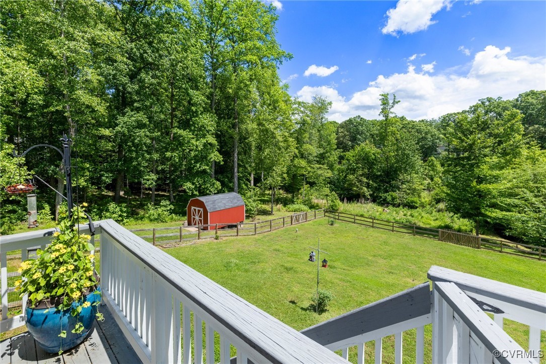 1629 Olmstead Drive Powhatan, VA 23139 - Photo 35 of 50 a view of a balcony with two chairs and a table