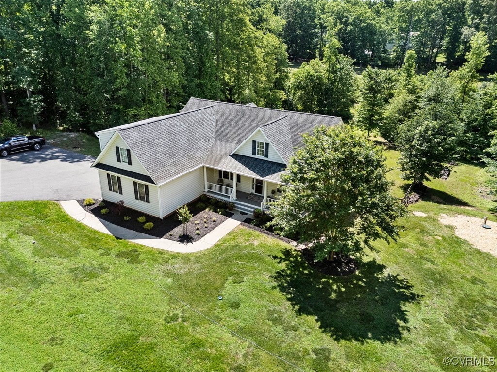 1629 Olmstead Drive Powhatan, VA 23139 - Photo 40 of 50 an aerial view of house with yard and trees in the background