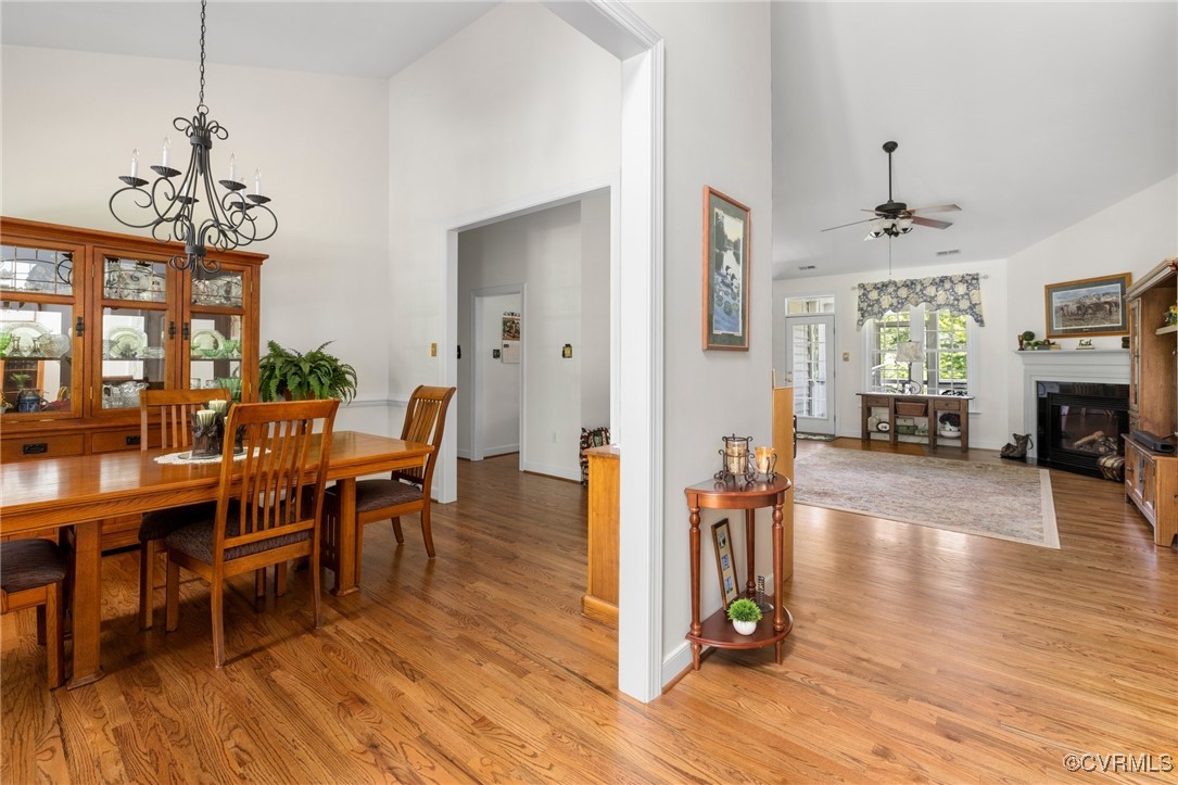 1629 Olmstead Drive Powhatan, VA 23139 - Photo 8 of 50 a view of a dining room with furniture wooden floor and a chandelier