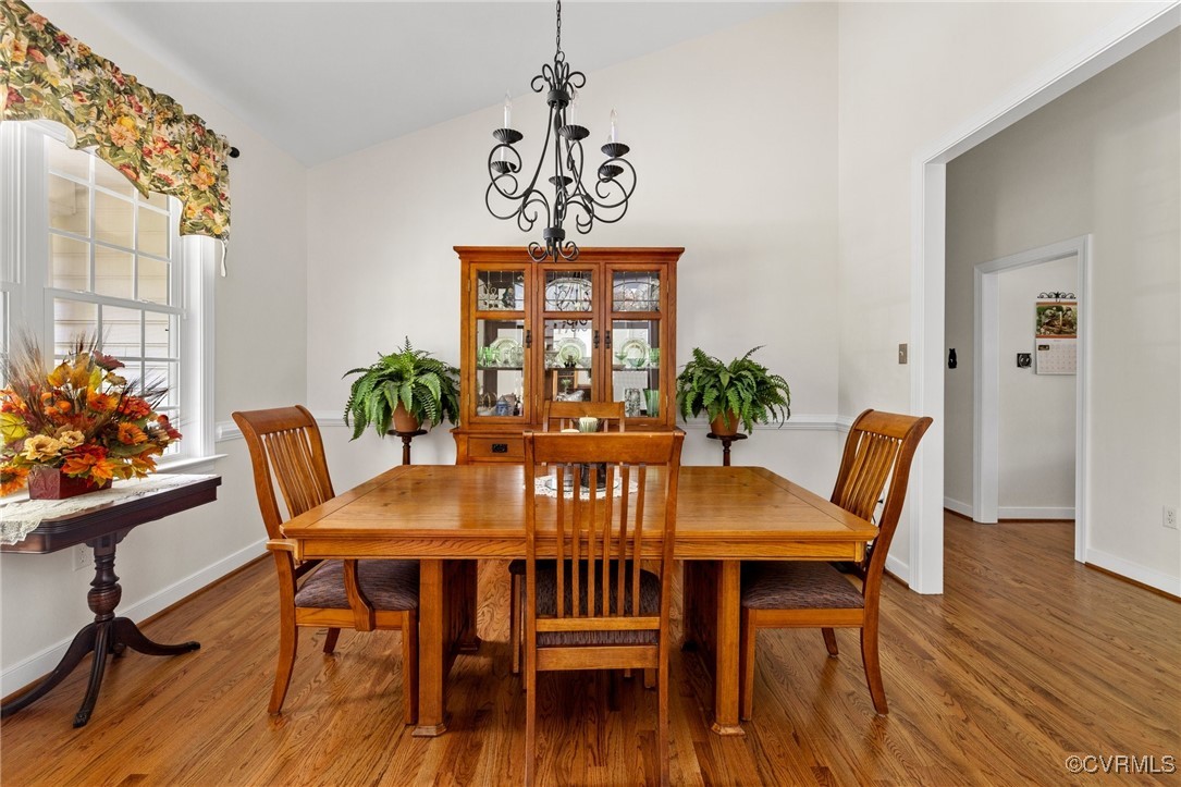 1629 Olmstead Drive Powhatan, VA 23139 - Photo 9 of 50 a view of a dining room with furniture window and wooden floor