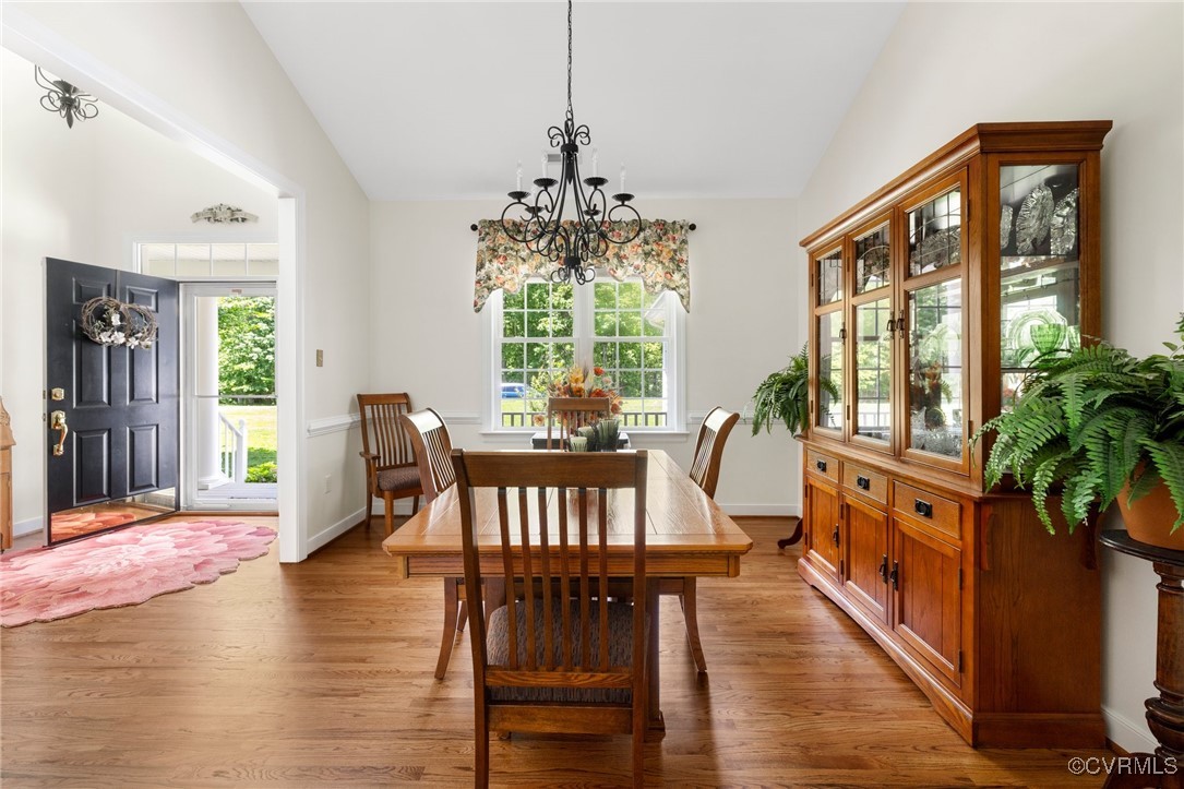 1629 Olmstead Drive Powhatan, VA 23139 - Photo 10 of 50 a view of a dining room with furniture window and wooden floor