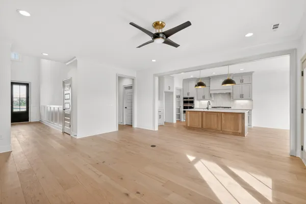 a view of a hallway with a kitchen