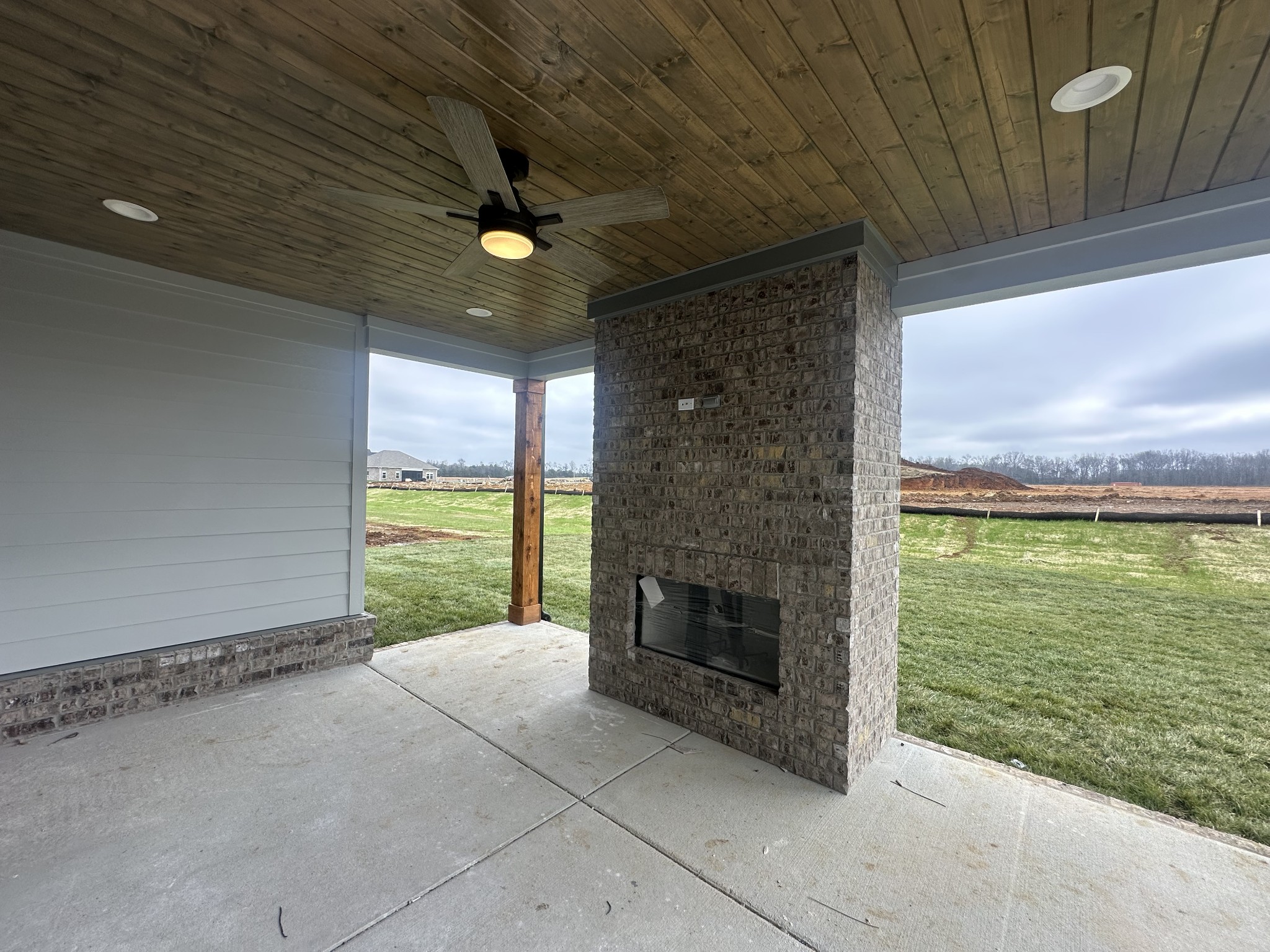 5541 Sinclair Street Murfreesboro, TN 37127 - Photo 21 of 29 a view of an empty room with a fireplace and a window