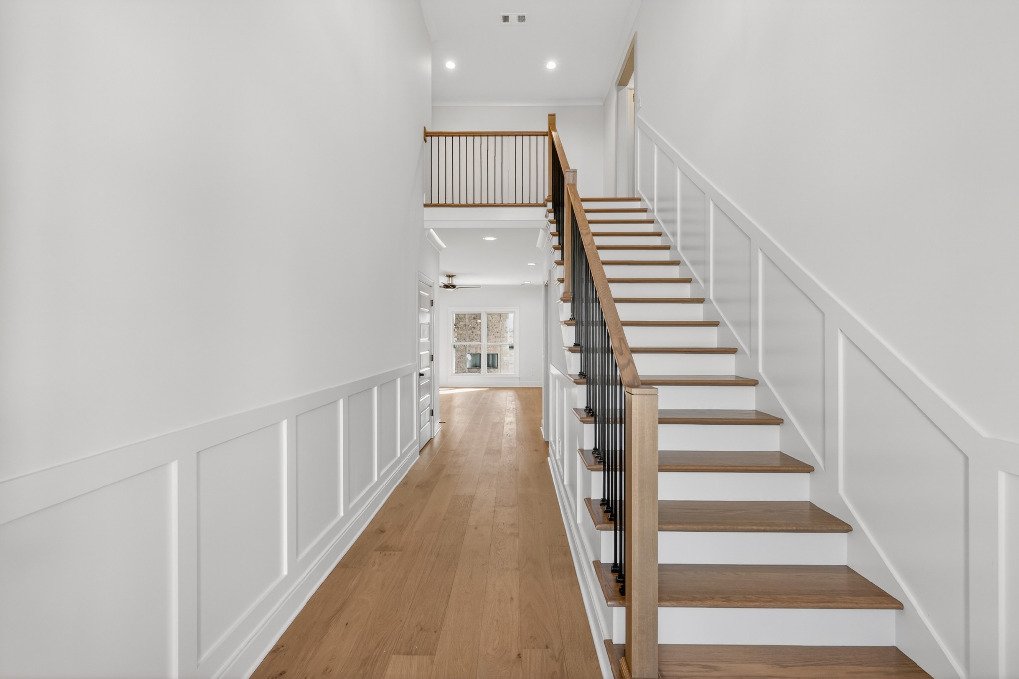 5541 Sinclair Street Murfreesboro, TN 37127 - Photo 5 of 58 a view of staircase with wooden floor and white walls