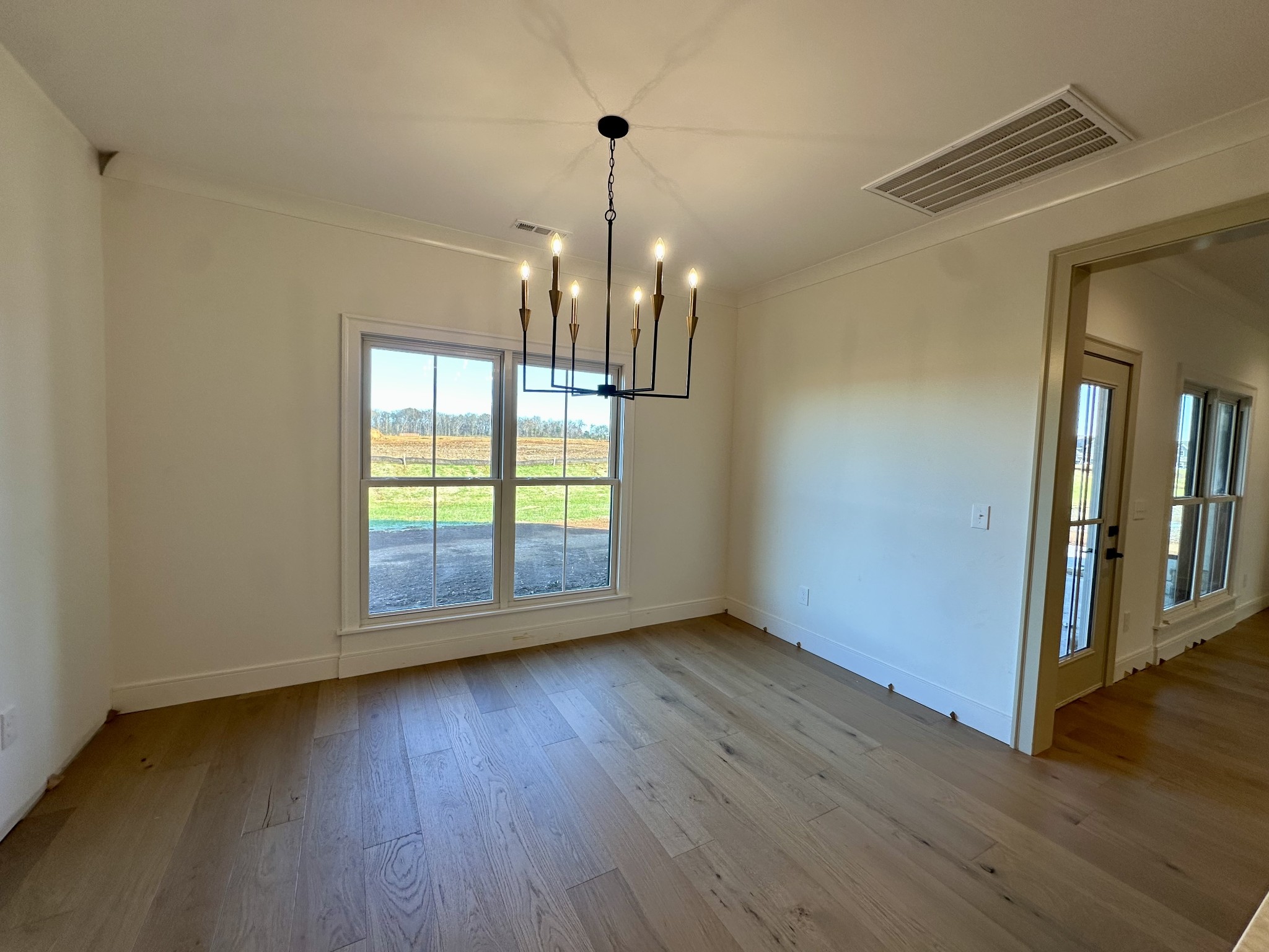 5541 Sinclair Street Murfreesboro, TN 37127 - Photo 8 of 29 a view of empty room with wooden floor and fan