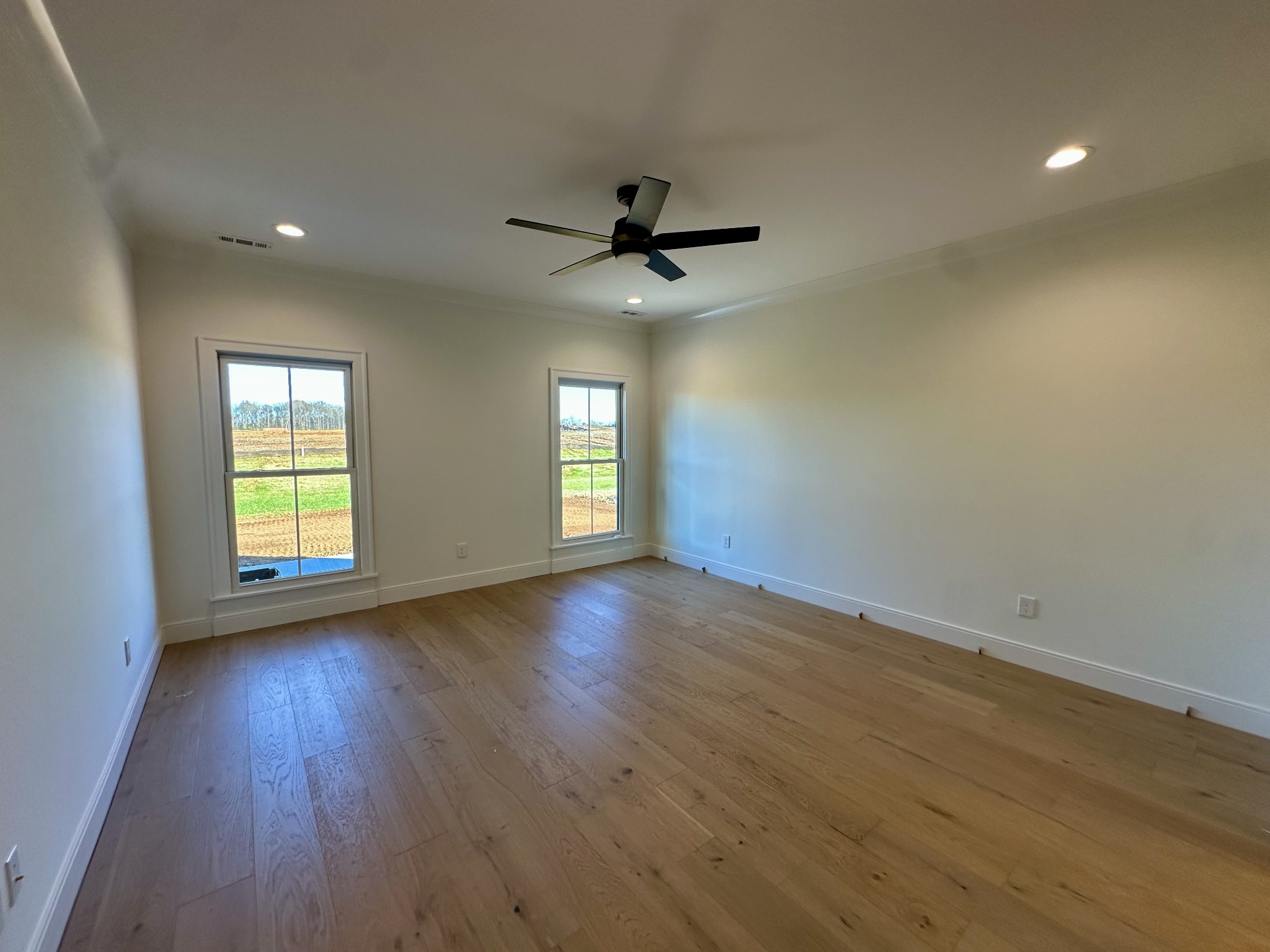 5541 Sinclair Street Murfreesboro, TN 37127 - Photo 9 of 29 an empty room with wooden floor and windows