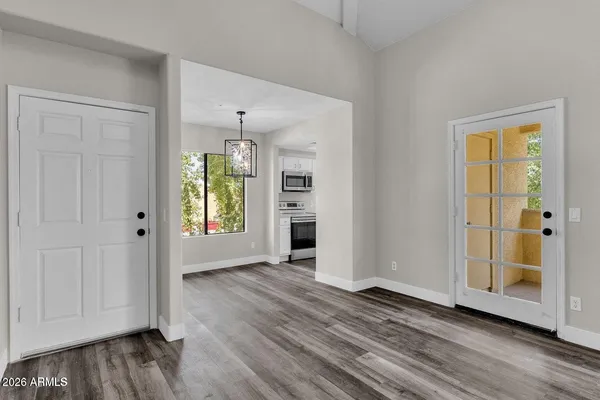 wooden floor in an empty room with a window