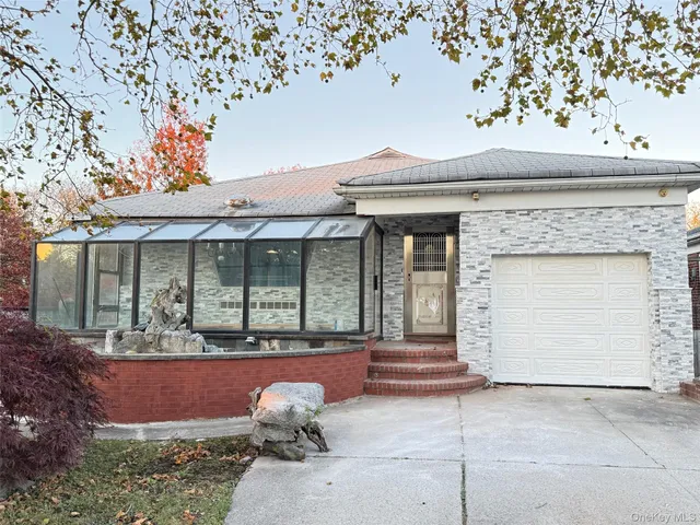 a front view of a house with garden