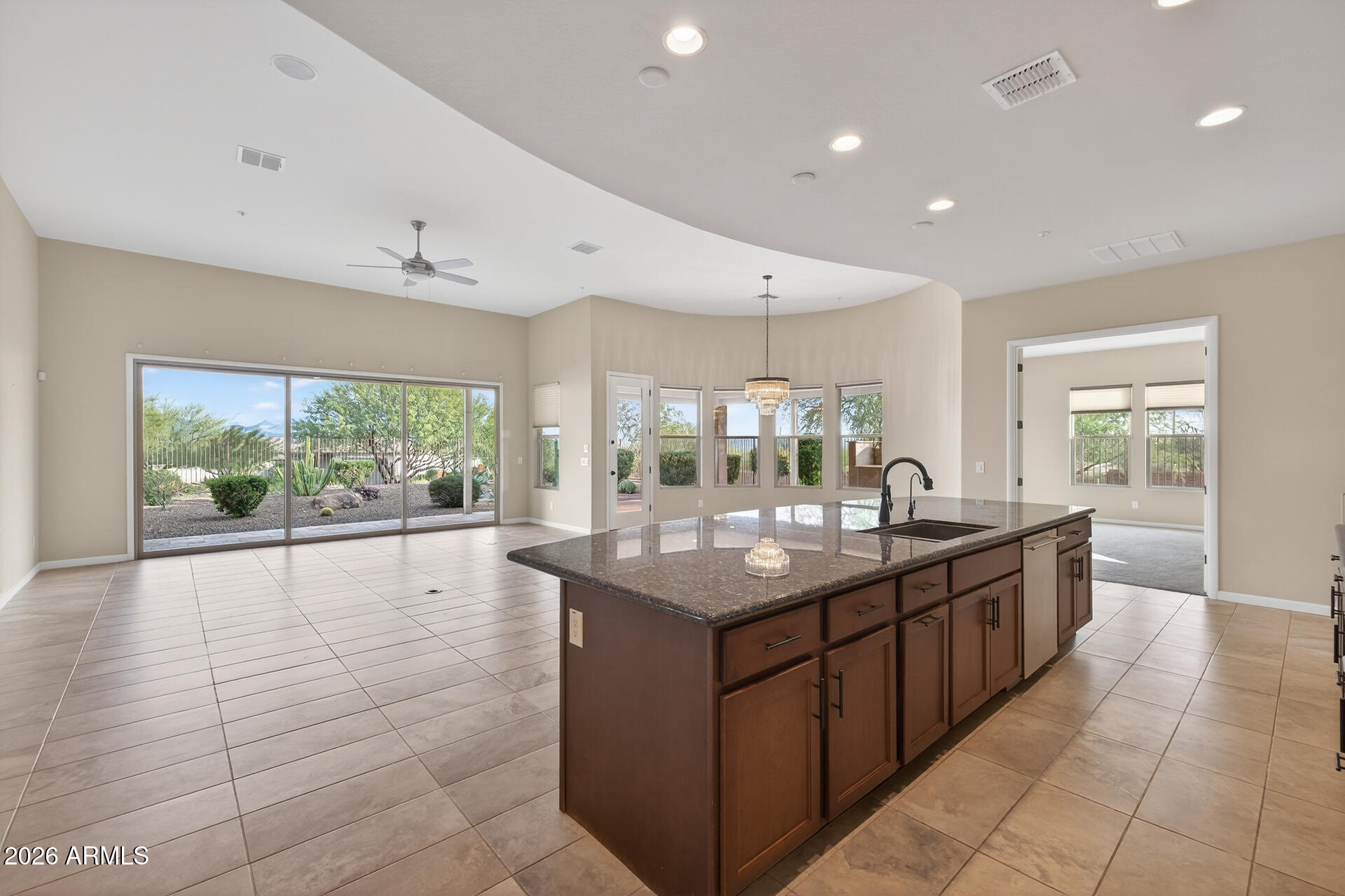 17662 Blaze Lane Rio Verde, AZ 85263 - Photo 10 of 68 a large kitchen with kitchen island a sink and a large window