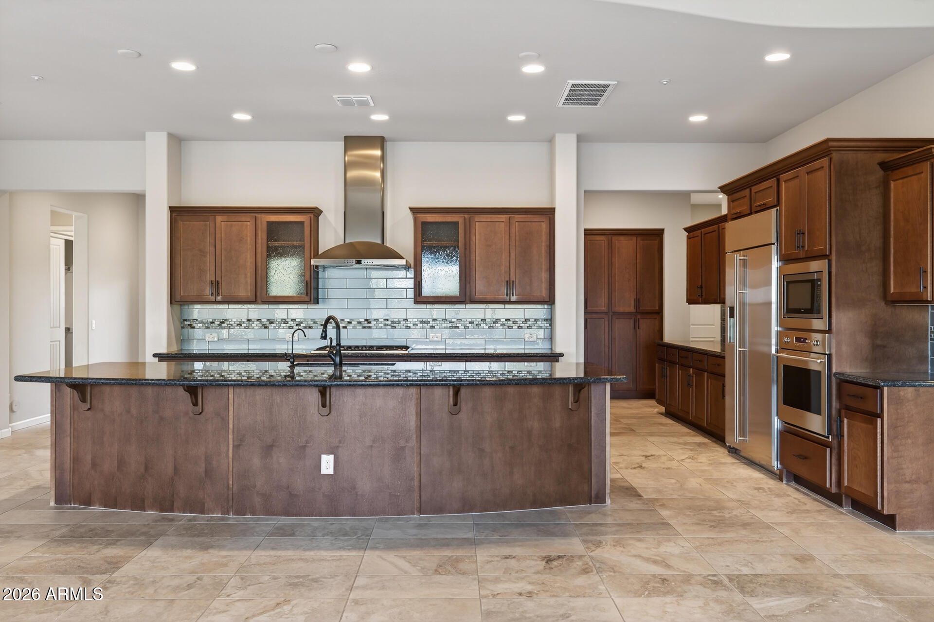 17662 Blaze Lane Rio Verde, AZ 85263 - Photo 13 of 68 a large kitchen with kitchen island a large counter top stainless steel appliances and cabinets