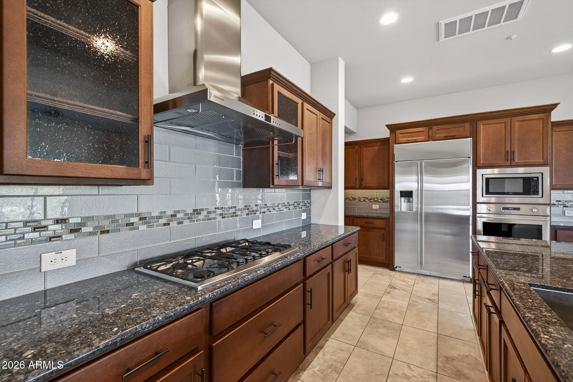 17662 Blaze Lane Rio Verde, AZ 85263 - Photo 14 of 68 a kitchen with stainless steel appliances granite countertop a stove a sink and a refrigerator