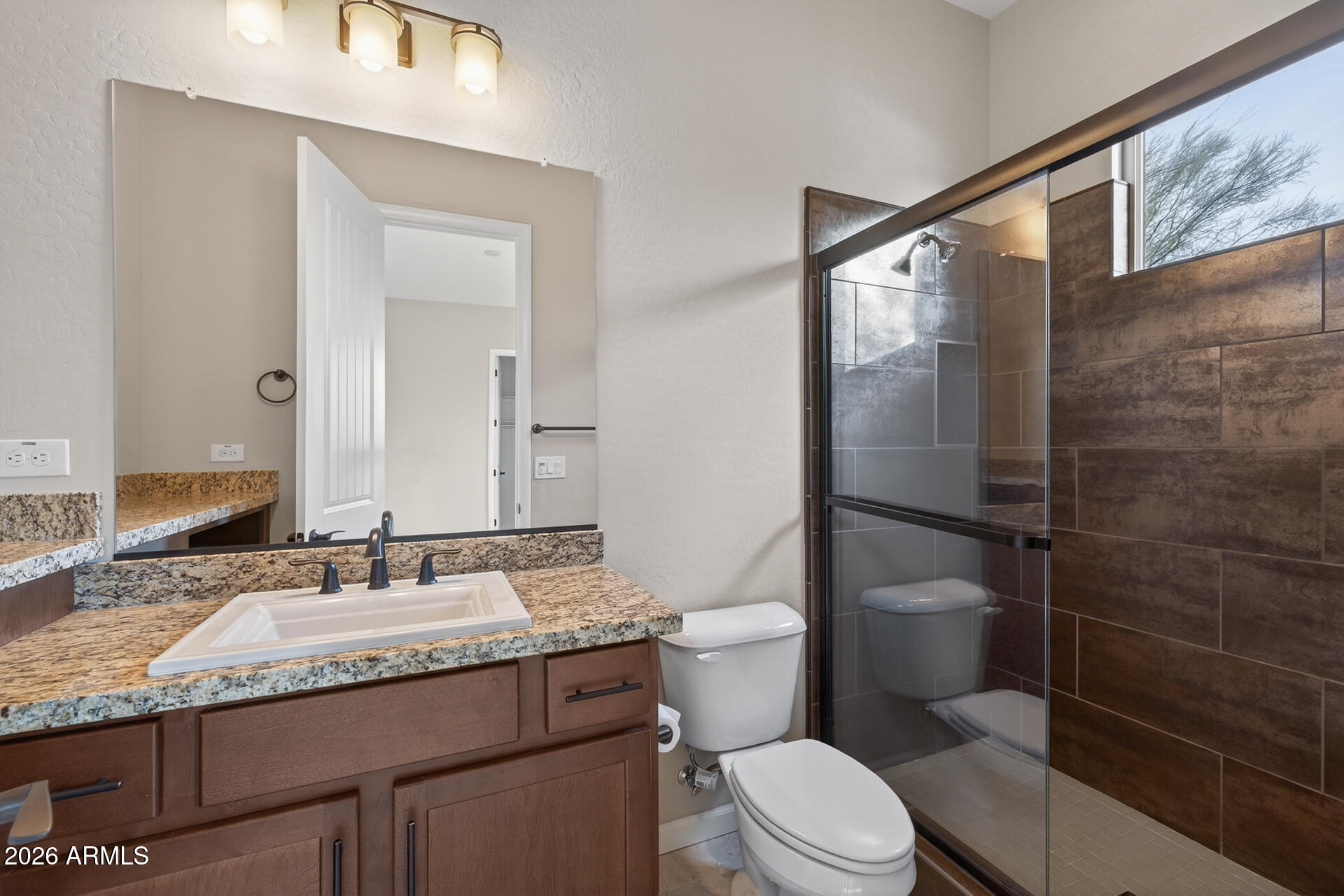 17662 Blaze Lane Rio Verde, AZ 85263 - Photo 29 of 68 a bathroom with a granite countertop sink mirror vanity and toilet