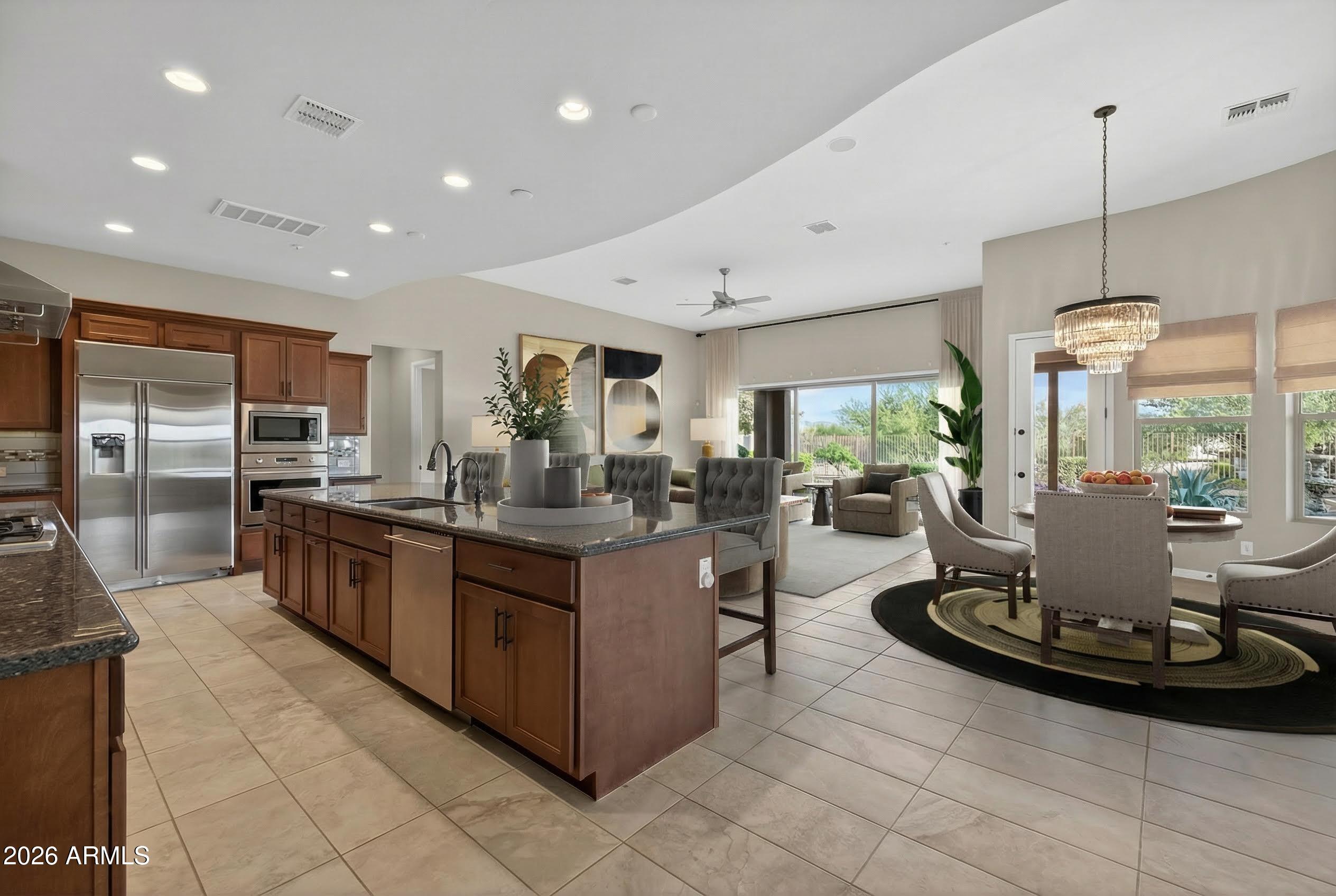17662 Blaze Lane Rio Verde, AZ 85263 - Photo 9 of 68 a kitchen with a large counter top cabinets and stainless steel appliances