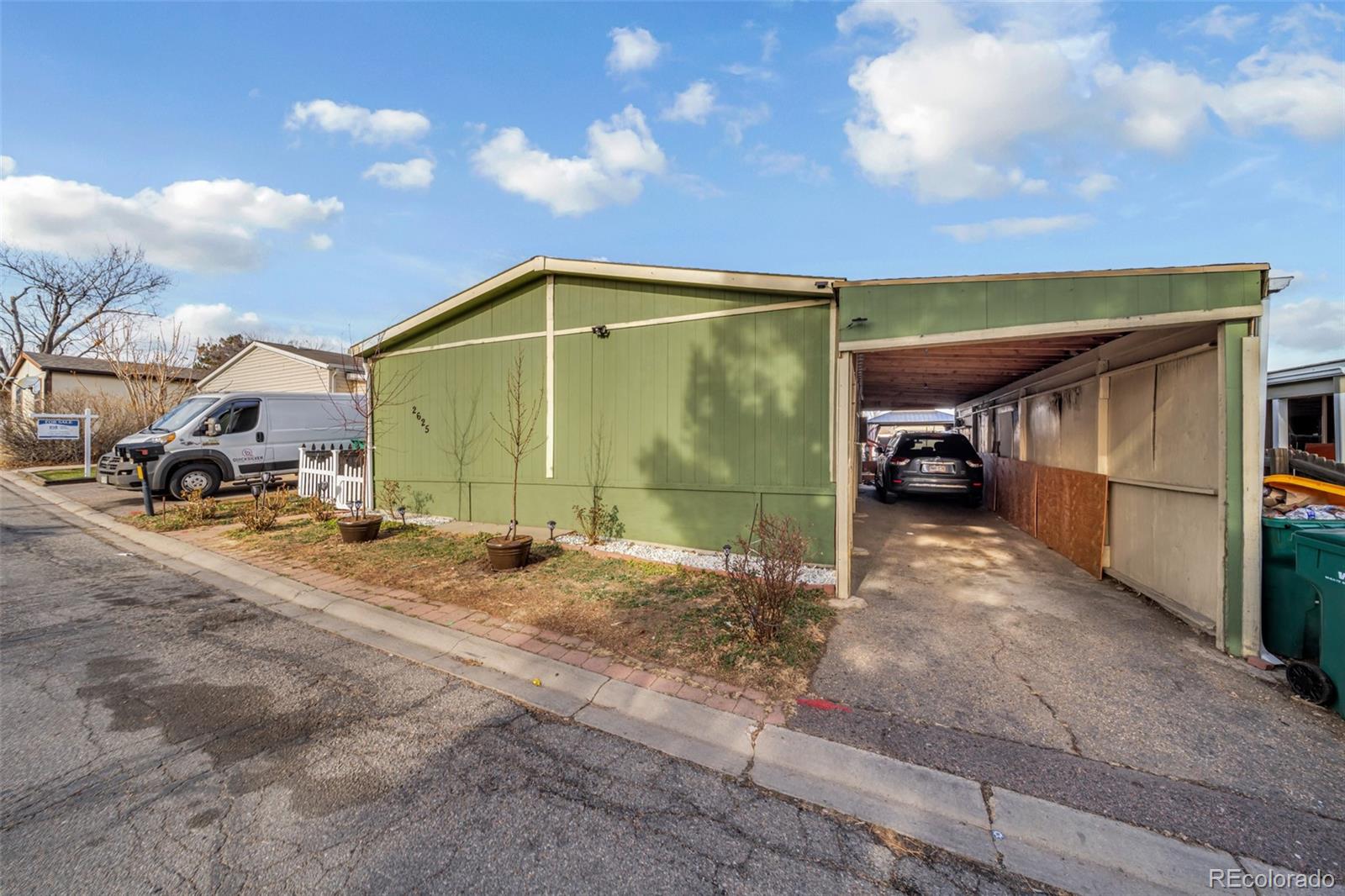 2625 Pheasant Street Denver, CO 80260 - Photo 15 of 18 a view of a car park in front of house