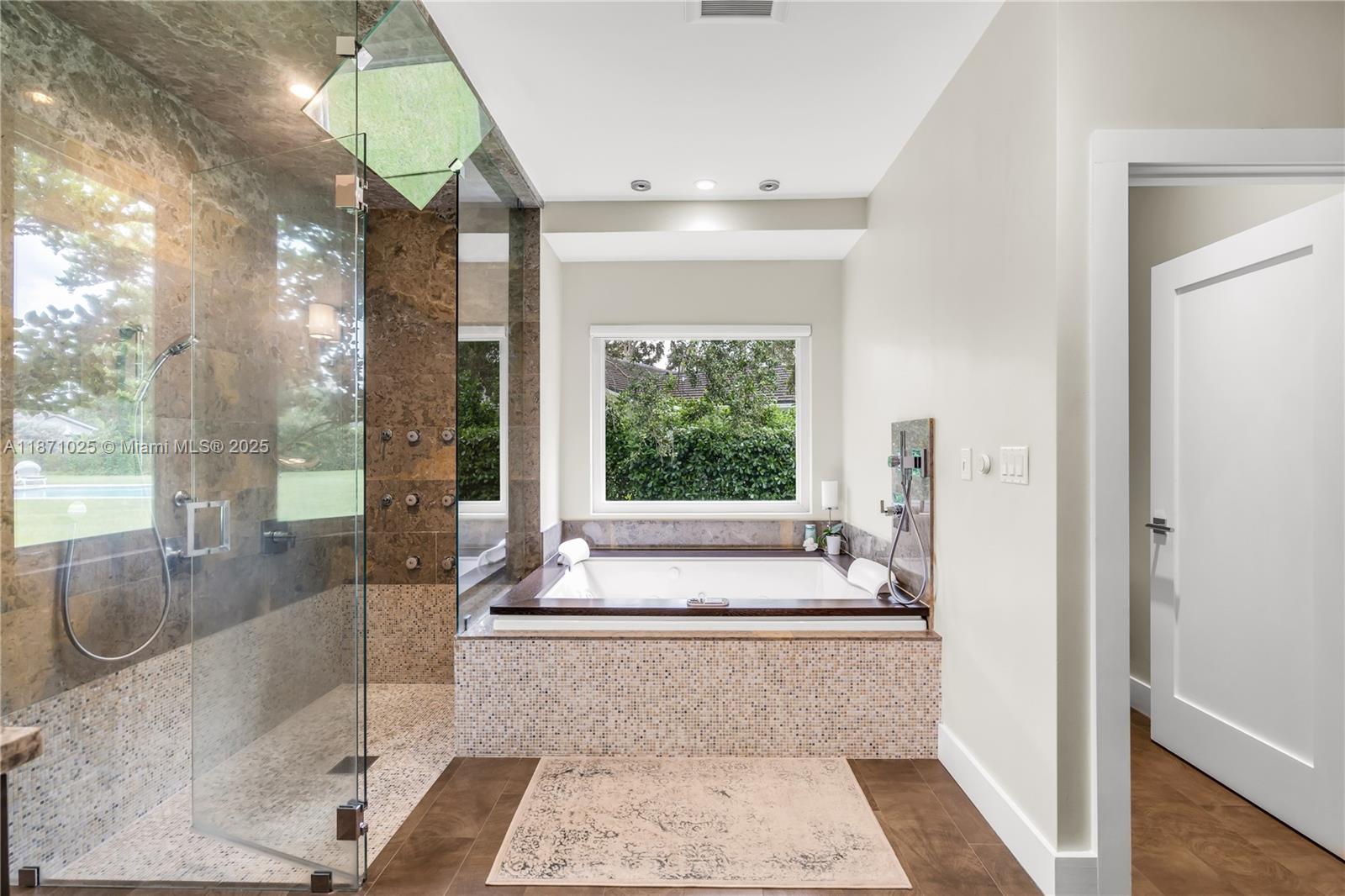 11835 Southwest 91 Avenue Miami, FL 33176 - Photo 31 of 66 a spacious en suite bathroom with a tub shower and window