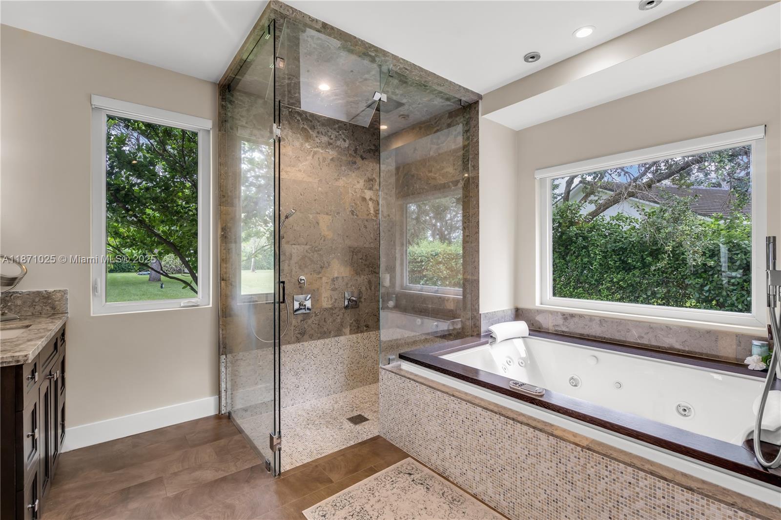 11835 Southwest 91 Avenue Miami, FL 33176 - Photo 32 of 66 a bathroom with a large tub and shower