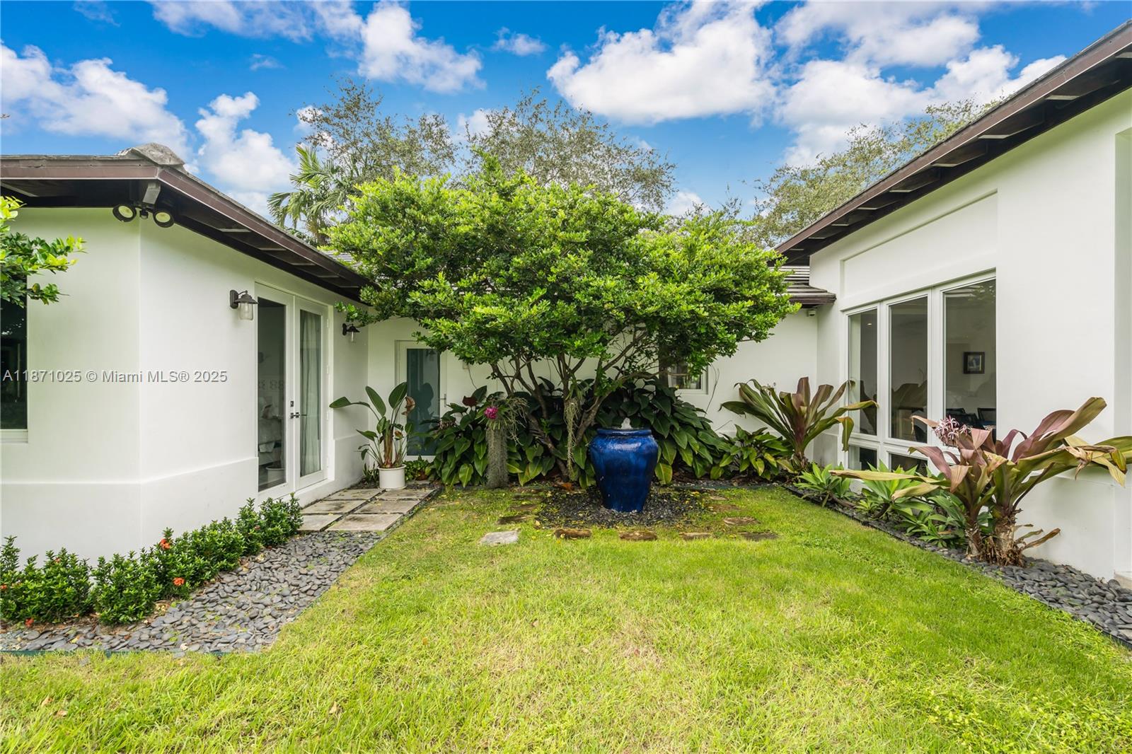 11835 Southwest 91 Avenue Miami, FL 33176 - Photo 34 of 66 a view of a house with a patio