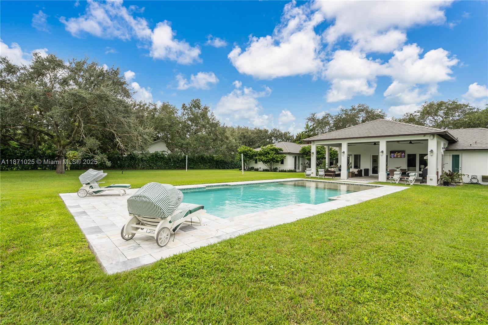 11835 Southwest 91 Avenue Miami, FL 33176 - Photo 39 of 66 a swimming pool with outdoor seating and yard