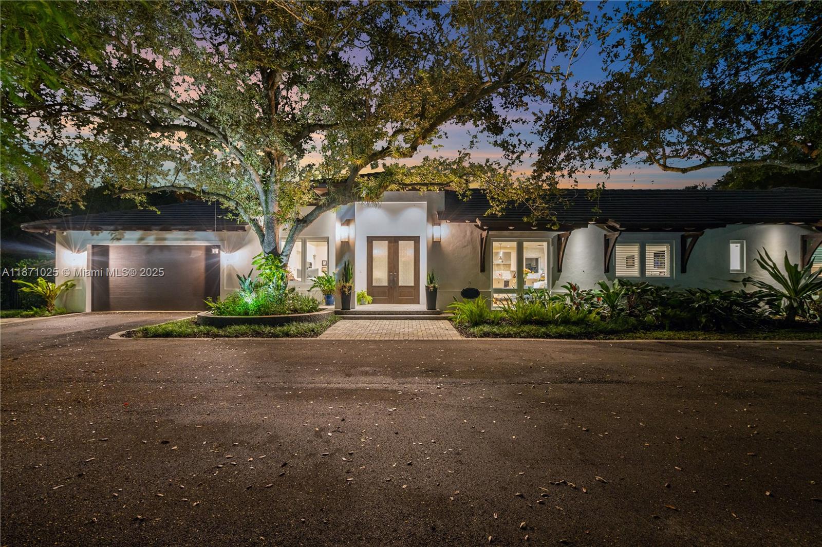 11835 Southwest 91 Avenue Miami, FL 33176 - Photo 46 of 66 a front view of a house with plants and trees