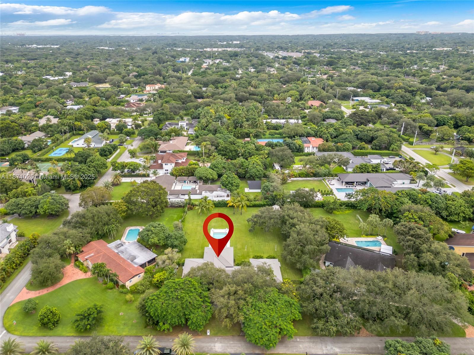 11835 Southwest 91 Avenue Miami, FL 33176 - Photo 65 of 66 an aerial view of residential houses with outdoor space and trees