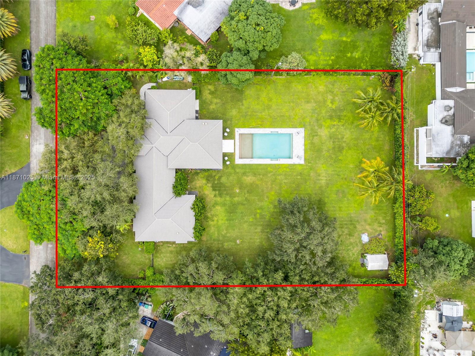 11835 Southwest 91 Avenue Miami, FL 33176 - Photo 66 of 66 an aerial view of a house with a garden and lake view