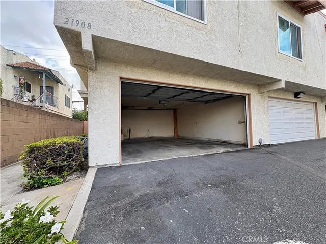 a front view of a house with a yard and a garage
