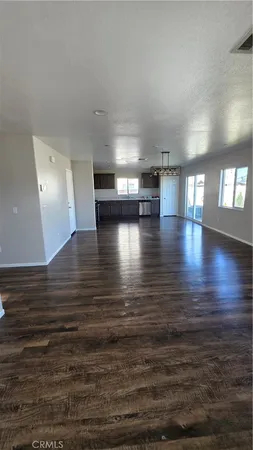 a kitchen with stainless steel appliances kitchen island granite countertop a sink and a stove