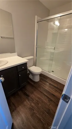 a bed sitting in a bedroom next to a larger window