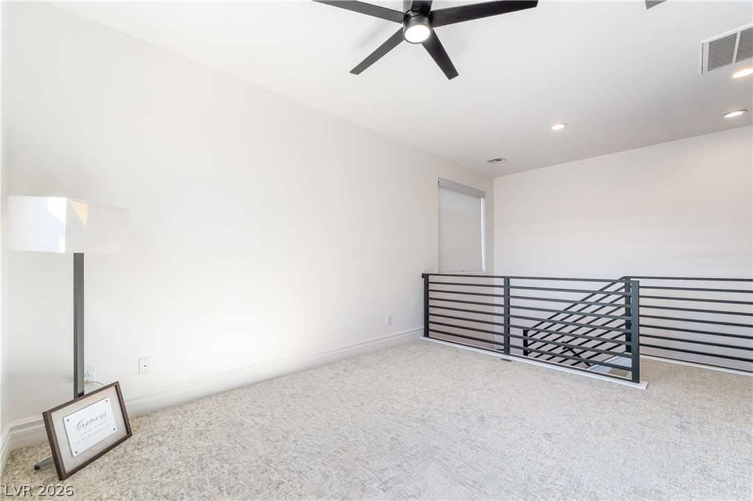 10206 Cider Mill Road Las Vegas, NV 89135 - Photo 11 of 39 Loft with upgraded metal railings and mounted TV
