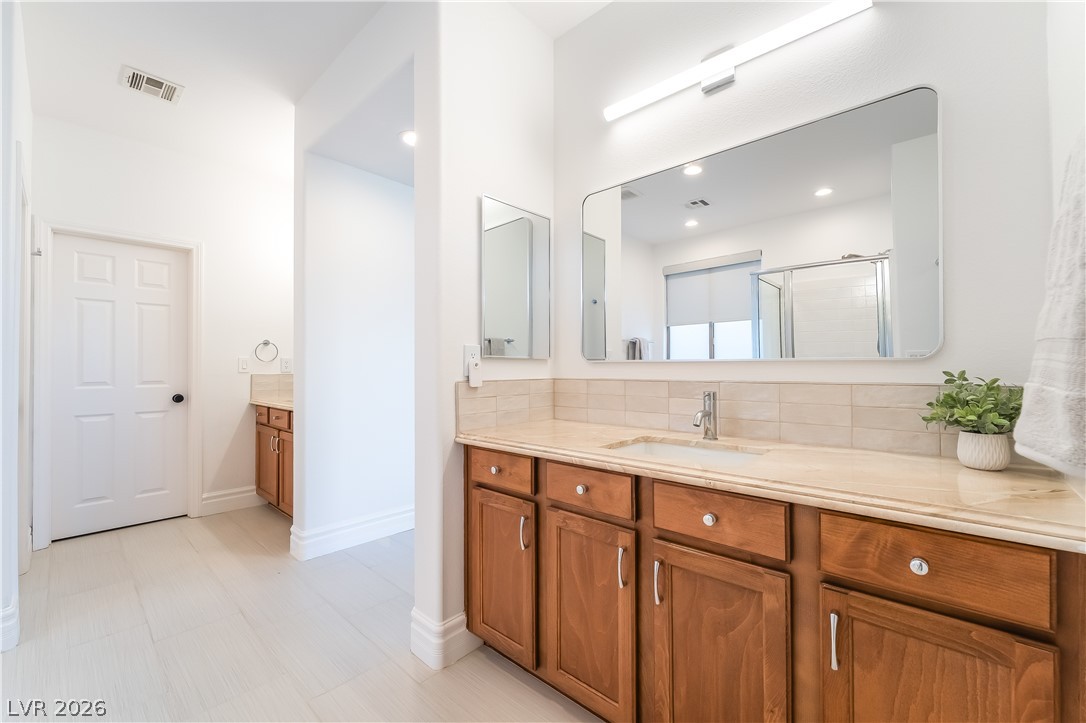 10206 Cider Mill Road Las Vegas, NV 89135 - Photo 17 of 39 Dual Closets access in Primary Bath