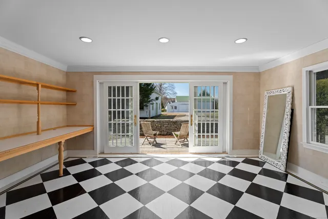 a view of a black and white checkered floor in a room