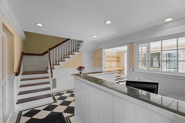 a kitchen with stainless steel appliances granite countertop a sink and a granite counter tops