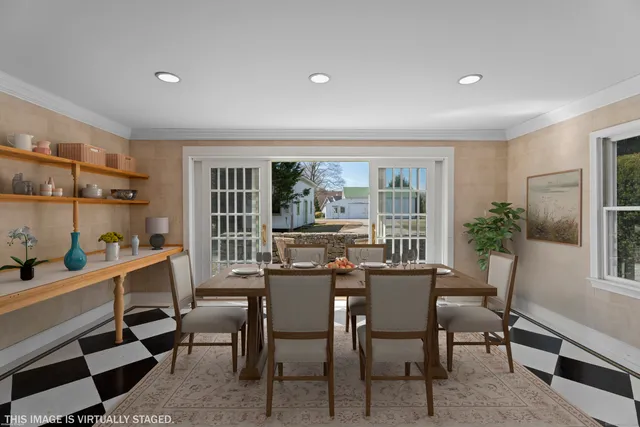 a view of a dining room with furniture window and outside view