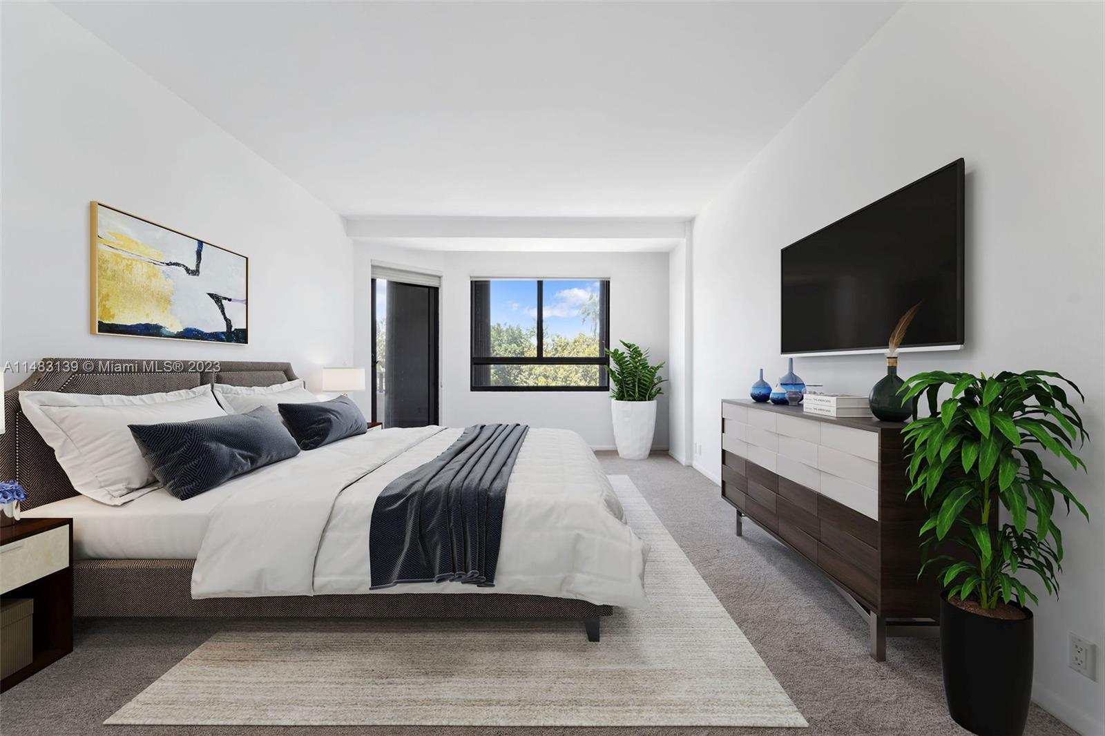 151 Crandon Boulevard, Unit 422 Key Biscayne, FL 33149 - Photo 18 of 38 a bedroom with a large bed and a flat screen television