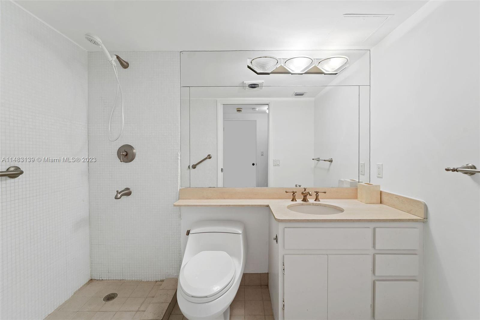 151 Crandon Boulevard, Unit 422 Key Biscayne, FL 33149 - Photo 26 of 38 a bathroom with a toilet sink a shower and vanity