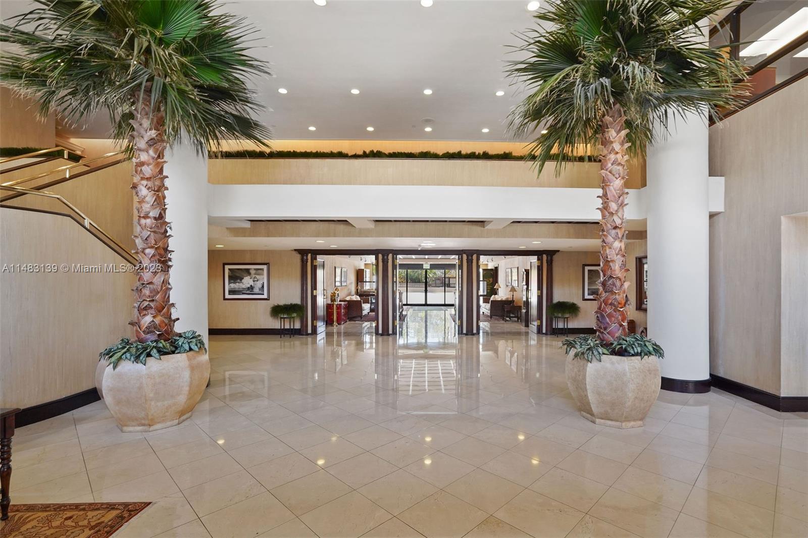 151 Crandon Boulevard, Unit 422 Key Biscayne, FL 33149 - Photo 33 of 38 a living room with furniture and a potted plant