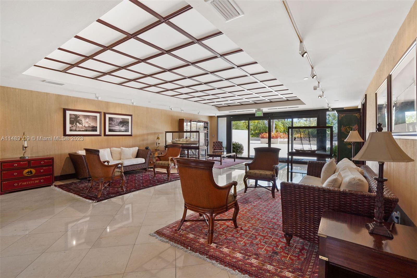 151 Crandon Boulevard, Unit 422 Key Biscayne, FL 33149 - Photo 35 of 38 a living room with furniture and a large window