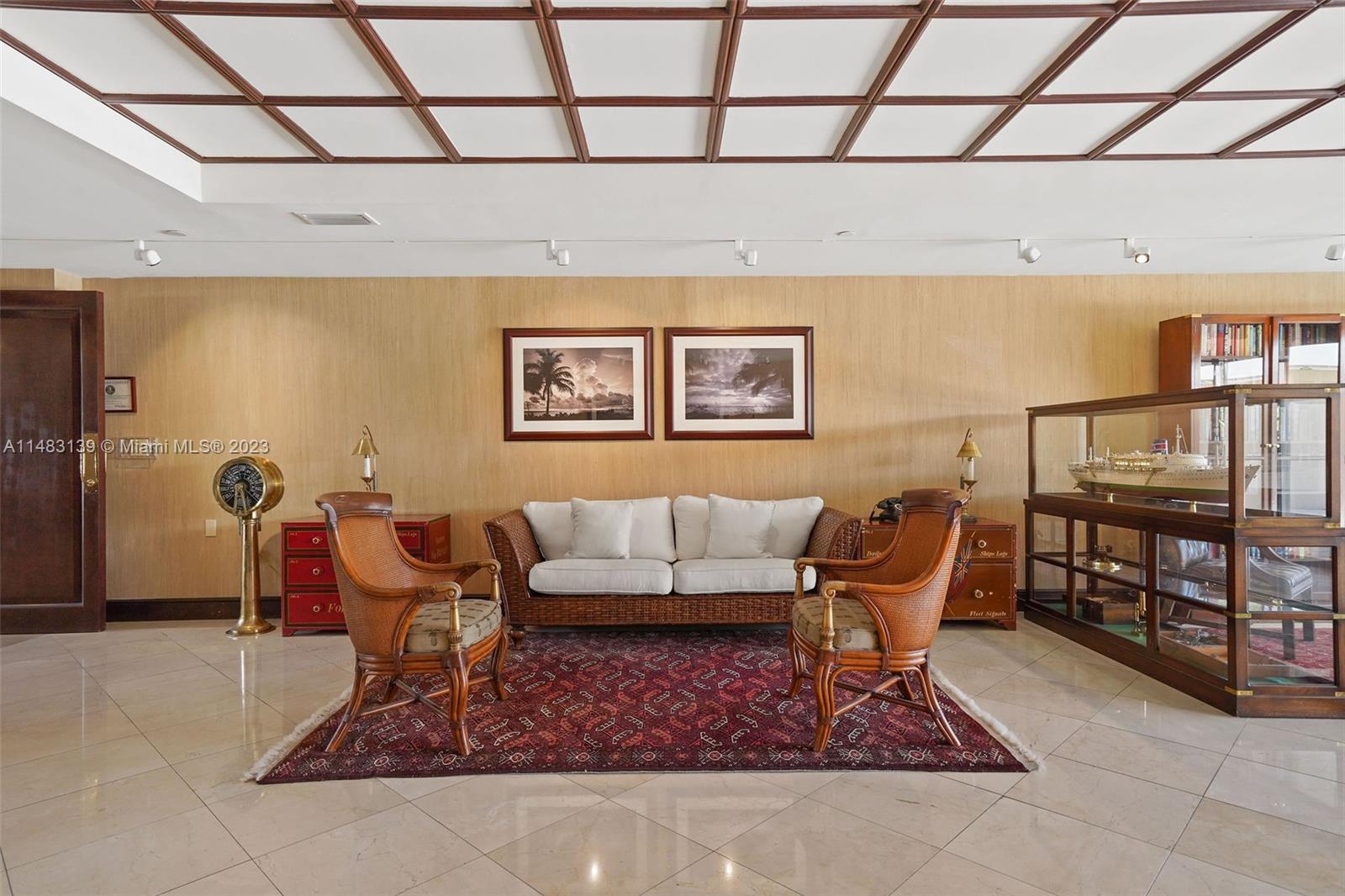 151 Crandon Boulevard, Unit 422 Key Biscayne, FL 33149 - Photo 36 of 38 a living room with furniture and a rug