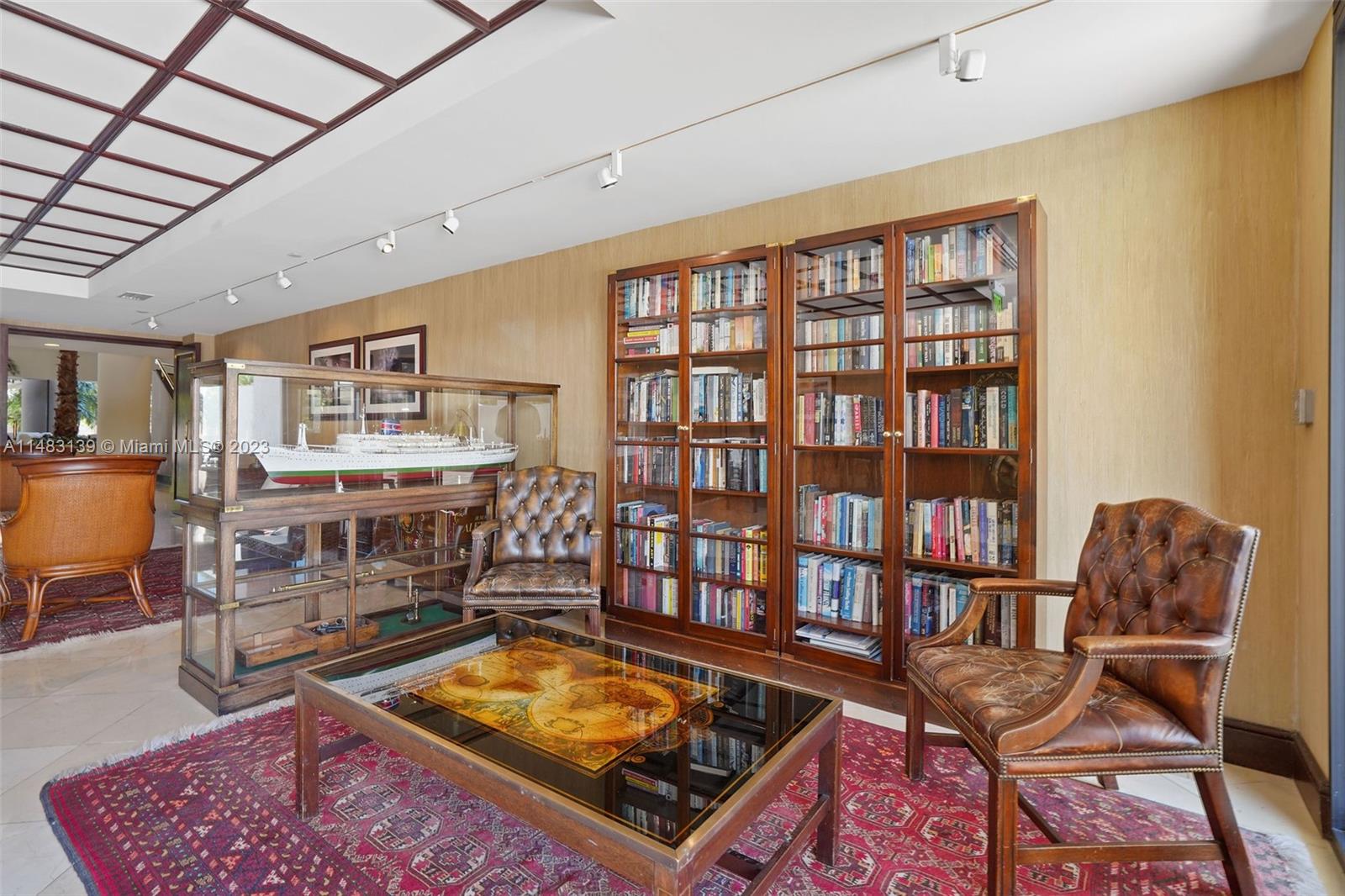 151 Crandon Boulevard, Unit 422 Key Biscayne, FL 33149 - Photo 37 of 38 a room with furniture and book shelf