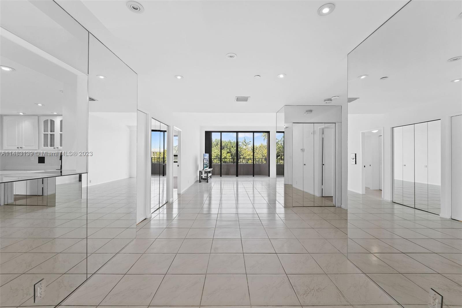 151 Crandon Boulevard, Unit 422 Key Biscayne, FL 33149 - Photo 10 of 38 a view of a living room kitchen with stainless steel appliances cabinets