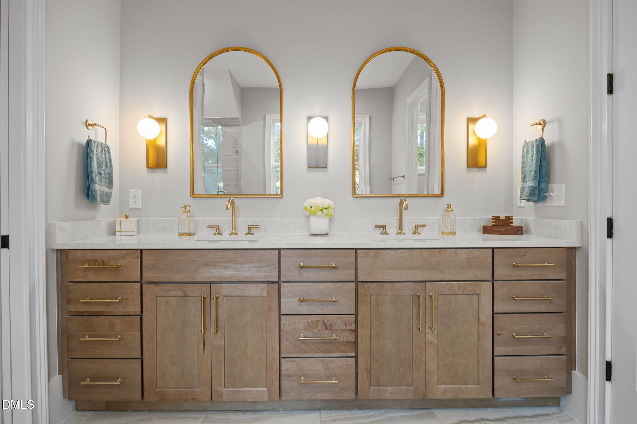 1404 Song Bird Crest Way Raleigh, NC 27613 - Photo 20 of 54 a bathroom with a double vanity sink and a mirror