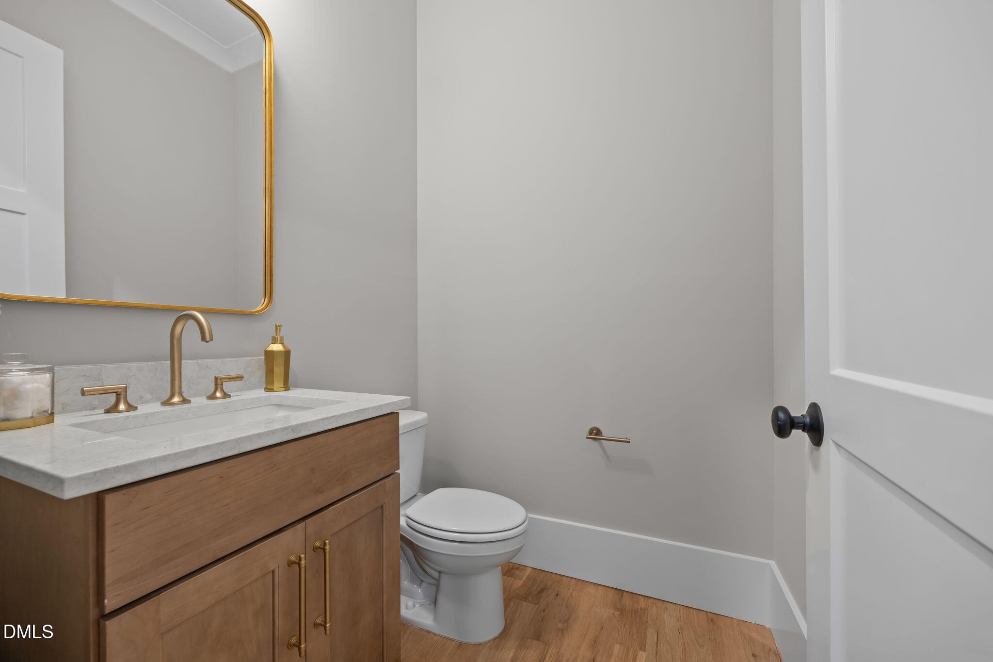 1404 Song Bird Crest Way Raleigh, NC 27613 - Photo 28 of 54 a bathroom with a toilet a sink a mirror and vanity