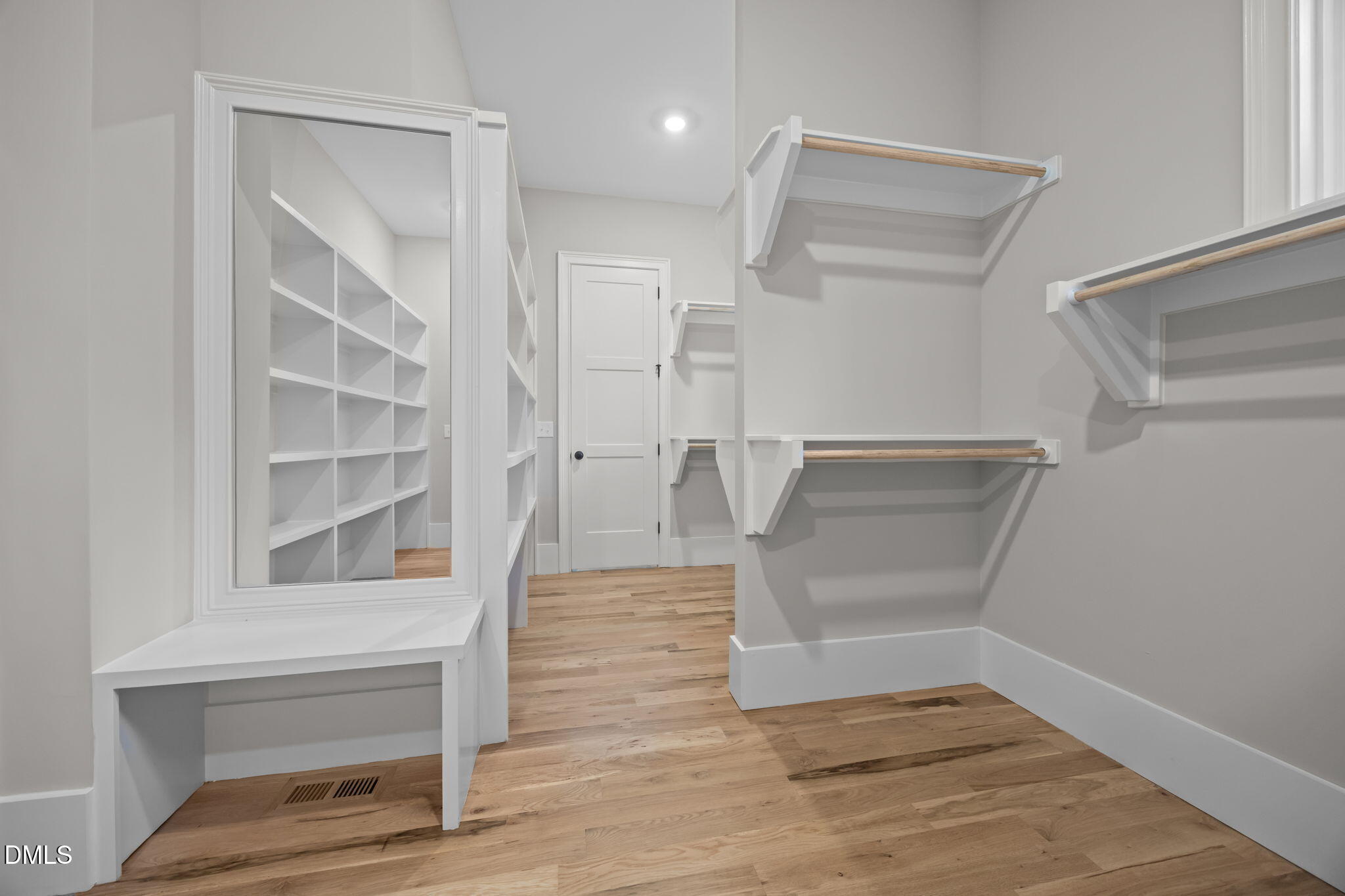 1404 Song Bird Crest Way Raleigh, NC 27613 - Photo 32 of 54 a view of walk in closet with empty racks